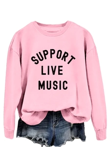 Pink crew neck sweatshirt featuring Support Live Music text paired with denim shorts