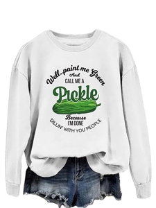Detailed view of white sweatshirt featuring green pickle graphic and funny quote text