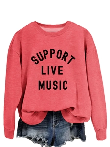 Detail of pink support live music sweatshirt showing fabric texture and black graphic print