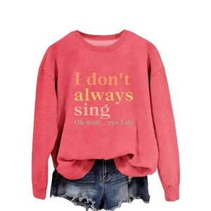 Red crewneck sweatshirt with 'I don't always sing' print paired with denim shorts