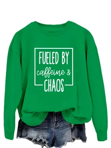Green long sleeve sweatshirt with Fueled by Caffeine and Chaos print and denim shorts