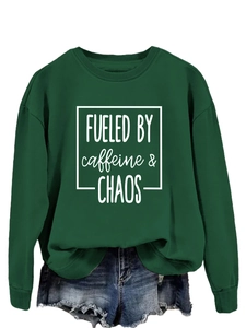 Detail of dark green sweatshirt with FUELED BY caffeine chaos print and ribbed collar