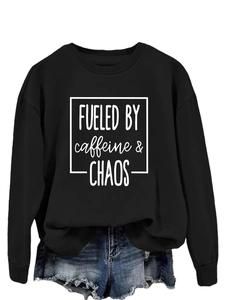 Detail of the high-quality white slogan print on a black long sleeve crewneck sweatshirt