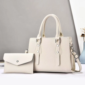 Minimalist beige pebble leather tote bag set with a matching small coin purse and strap