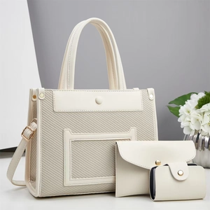 Three-piece women's handbag set featuring tote, envelope bag and card holder in cream texture