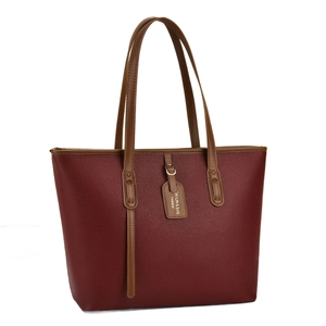 Sac cabas bordeaux grainé avec poignées marron et étiquette de marque élégante