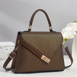 Brown monogram top handle handbag with gold hardware and adjustable shoulder strap