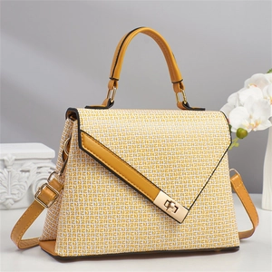 Chic mustard yellow satchel bag with geometric woven texture and gold metal hardware