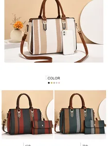 Detailed view of color-block striped tote bag with matching pouch and metal chain strap