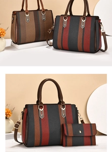 Detail of large striped tote bag with matching long wallet and gold hardware accents