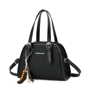 Chic black canvas semi-circle handbag with leather trim and wooden bead tassel decor