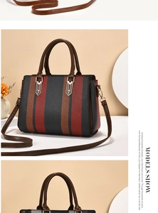Detail of color-block striped handbag showing golden hardware and adjustable brown shoulder strap