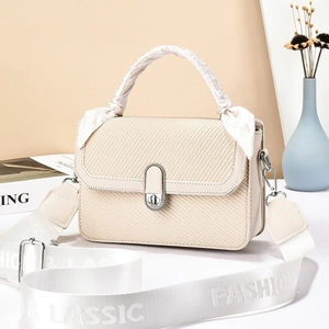 Fashionable cream white square crossbody bag with silk scarf handle and canvas strap
