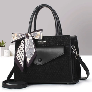 Black knit leather tote bag with multi-compartments and decorative silk scarf accessory