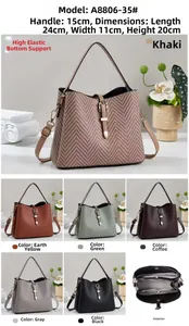 Detailed view of women handbag with V-weave texture and metal buckle, dimensions 24x11x20cm
