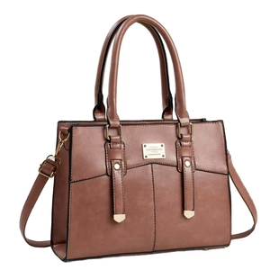 Brown PU leather tote bag with sturdy handles, crossbody strap and gold metal hardware