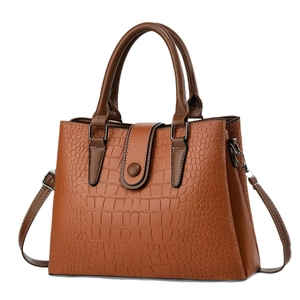 Classic brown crocodile embossed leather handbag with top handles and adjustable shoulder strap