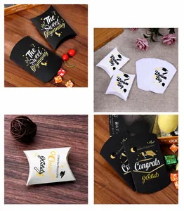Detail of graduation pillow gift boxes in black and white with Dream Big motifs