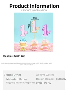 Detail of glittery number one cake toppers with 3D butterfly designs for baby birthday