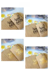 Detailed view of kraft paper gift bags with Happy Birthday text and butterfly patterns