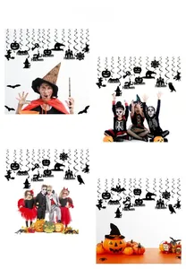 Detail view of Halloween hanging swirl decorations with black bats and pumpkin cutouts