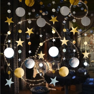 Detail of hanging star and circle garlands with metallic gold and silver mirror finishes