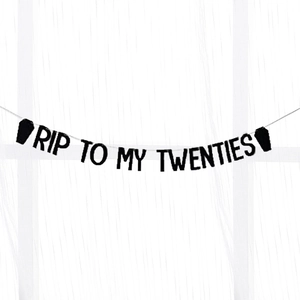 Close-up of black glitter RIP TO MY TWENTIES banner with coffin ends for 30th birthday