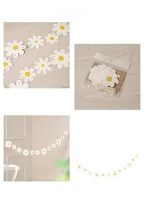 Detail of white daisy flower garland banners for birthday party wall decorations