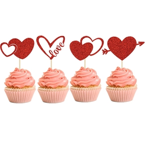 Close-up of red glitter heart cupcake toppers with love wordings for party cakes
