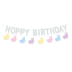 Close-up of Hoppy Birthday banner with silver glitter letters and pastel bunny cutouts
