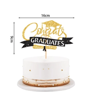 Detail of glittery Congrats Graduates cake topper with black academic cap and size dimensions