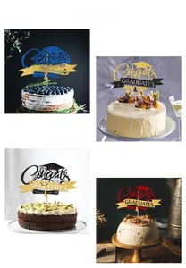 Close-up of sparkling Congrats GRADUATES cake toppers in assorted glitter colors