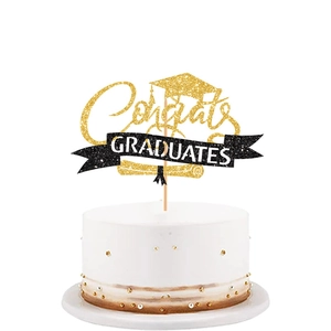 Golden Congrats Graduates cake topper with graduation cap and scroll on white cake