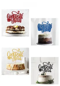 Close-up of Congrats Grad glitter cake toppers in red, blue, gold, and black finishes