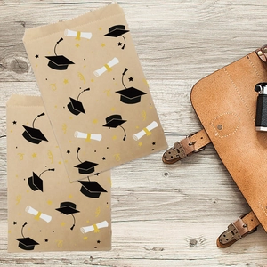 Kraft paper graduation gift bags featuring mortarboard and diploma prints with jagged edges