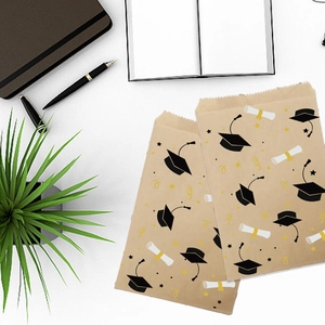 Brown kraft paper graduation gift bag featuring black mortarboard and diploma scroll
