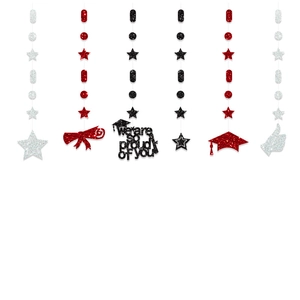 Macro view of graduation banners with glitter stars and Proud of You hanging decorations