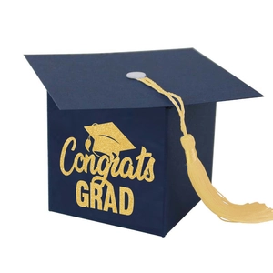 Dark blue graduation cap favor box with gold Congrats Grad text and elegant gold tassel