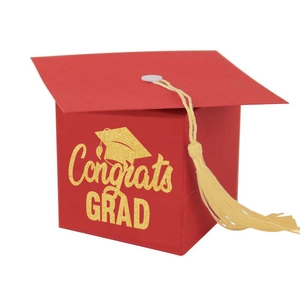 Red graduation cap gift box with gold tassel and Congrats Grad text for party favors
