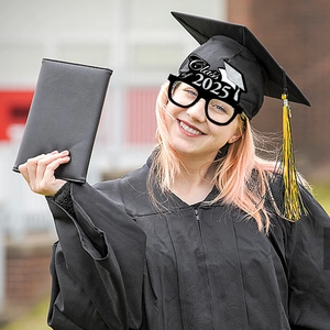 Class of 2025 graduation party glasses with glitter doctoral cap on a graduate model
