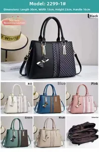 Detailed view of women's color-block handbag with triple layers and 30x13x23cm dimensions