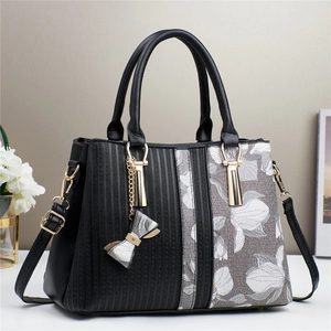 Women's tote bag with floral embroidery and geometric patterns in black and grey