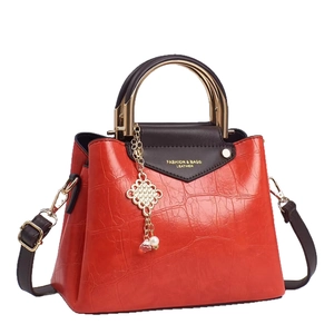 Bolso de mano naranja de moda en cuero PU con patrón de cocodrilo y asas doradas