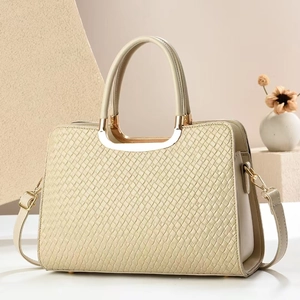 Elegant cream woven handbag for women with gold hardware and matching crossbody strap