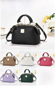 Detailed dimensions of Boston handbag featuring lychee texture and metallic bird logo