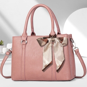 Große rosa Handtasche aus Leder mit drei Reißverschlüssen und Schleifendekor