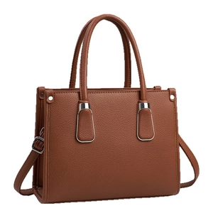 Brown lychee pattern leather handbag with silver metal hardware and detachable strap