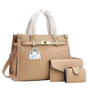 Three-piece beige handbag set featuring crocodile pattern with metal buckle detail