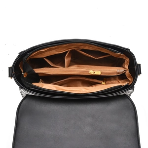 Interior view of women's bag showing large capacity compartments and gold zipper