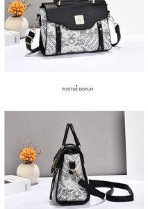 Detail of embroidered crossbody bag with wavy patterns and golden metal buckle